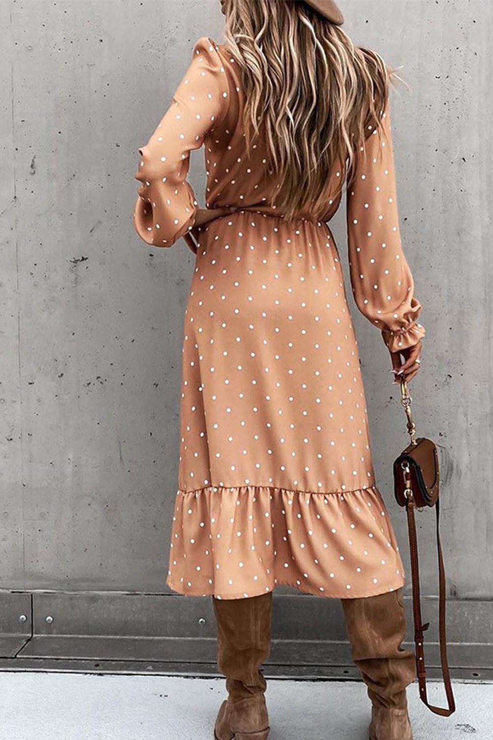 Jade women's polka dot midi dress with high slit and ruffled details, featuring button accents and a flowing silhouette.