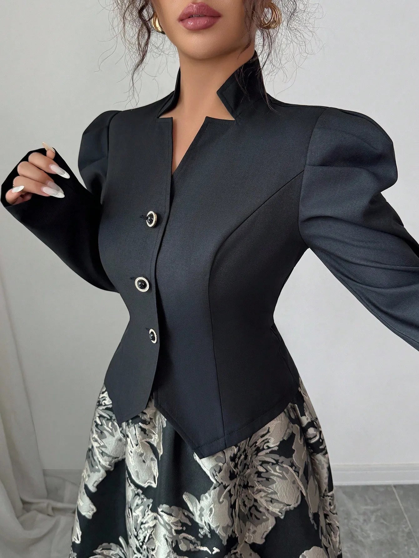 Elegant black blazer with puff sleeves paired with a floral A-line skirt, stylish women's office to evening wear set by Spur & Silk.